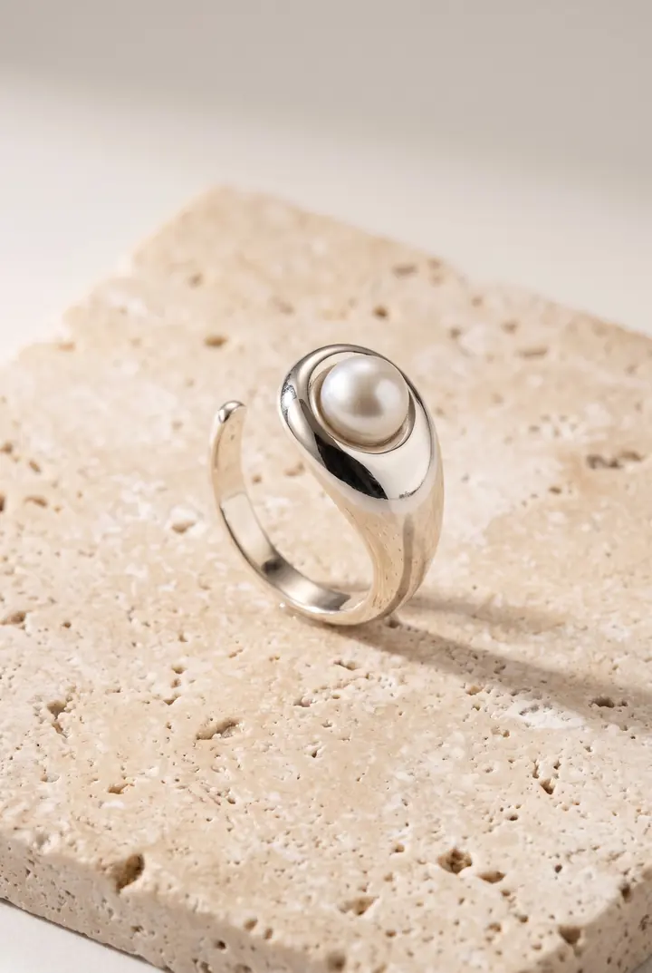 A pearl ring on travertine stone